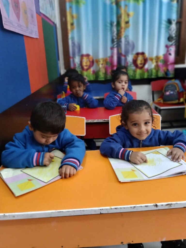 Children colouring shapes in the classroom